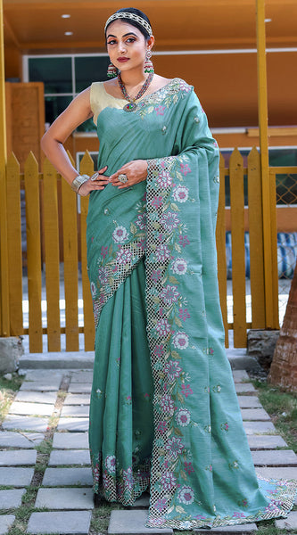 Designer Rama Embroidery Work Soft Silk Saree With Mesmerising Blouse Piece