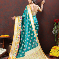 Engaging Firozi Organza Silk Saree With Tempting Blouse Piece