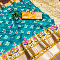 Engaging Firozi Organza Silk Saree With Tempting Blouse Piece
