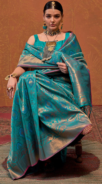 Precious Firozi Kanjivaram Silk Saree With Gleaming Blouse Piece