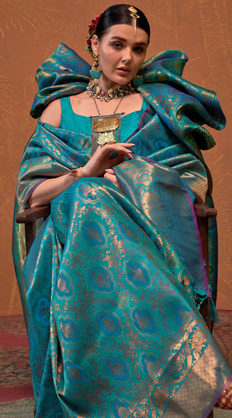 Precious Firozi Kanjivaram Silk Saree With Gleaming Blouse Piece