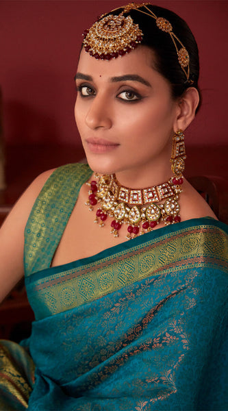 Ravishing Rama Kanjivaram Silk Saree With Flameboyant Blouse Piece
