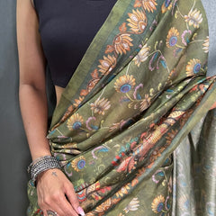 Captivating Green Kalamkari Printed Saree With Prominent Blouse Piece