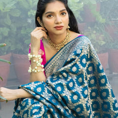 Prodigal Teal Blue Soft Banarasi Silk Saree With Inimitable Blouse Piece