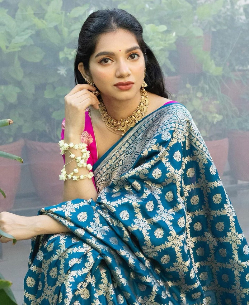 Prodigal Teal Blue Soft Banarasi Silk Saree With Inimitable Blouse Piece